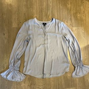 Soft Light Blue Satin Blouse Size XS with Ruffle Sleeves at the Wrist.